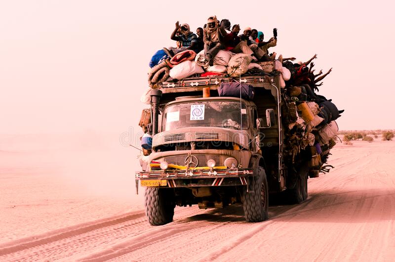 war-refugees-overloaded-truck-sahara-exposed-to-wind-heat-dust-lot-each-kind-use-transit-escape-174417973.jpg